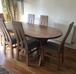 A Brand New Design of Dining Table and Chairs handcrafted from solid Pine with an elegant Oak stain and lacquered finish&period; : Click Here To View Larger Image